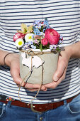 Spring bouquet with Easter decoration in DIY concrete pot