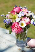 Colorful spring bouquet of bellis, ranunculus and forget-me-nots