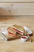 Grilled sandwich with bacon and tomatoes