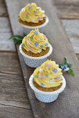 Vegan almond cupcakes with mango mascarpone topping