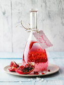 Pomegranate liqueur with chili and allspice