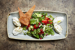 Labneh with salad and crispy flatbread