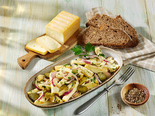 Hearty cheese salad with gherkins