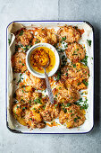 Crispy smashed potatoes with parmesan and chili garlic oil