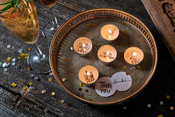 Tea lights with a message for a chalet evening