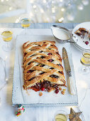 Minced meat tart with apples, cranberries and lattice pastry for Christmas