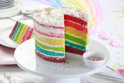 Rainbow cake, with a piece cut out