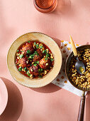 Meatballs with tomato sauce, pine nuts and parsley