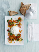Burrata with sweet and sour shallots. pine nuts and golden