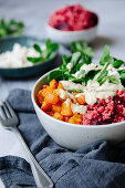 Winter bowl with pumpkin, beetroot couscous and lamb's lettuce