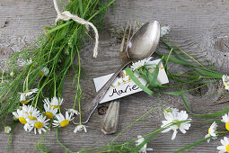 Camomile, place card, and silverware