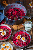 Beetroot and red kidney bean soup with cabbage and egg, ukrainian borsch