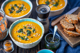 Cream of pumpkin and lentil soup with pesto