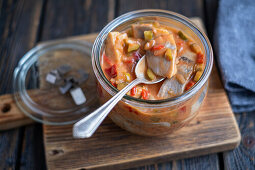 Herring with cornichons, pepper, onion and tomato hot sauce