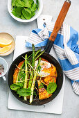 Potato fritters with asparagus, spinach and poached egg