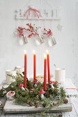 Advent wreath made from hemlock with red candles