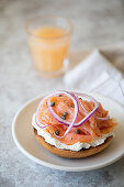 Bagel with cream cheese, salmon, capers, and onion