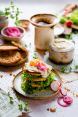Gluten-free chickpea pancakes with salad and a fried egg