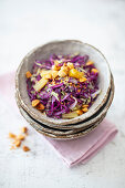 Red cabbage salad with pineapple, peanuts, and toasted shredded coconut