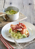 Sausages with potato and pea mash and fried onion