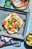 Pizza with prawns, cherry tomatoes and courgettes