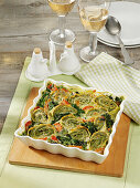 Oven-baked maultaschen (Swabian ravioli) and spinach casserole