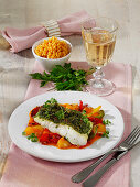 Cod fillet with herb crust on roasted peppers