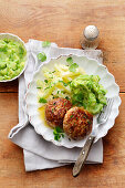 Meatballs with creamed kohlrabi and mashed potatoes and peas