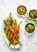 Small spinach souffles and carrots with asparagus in pine butter