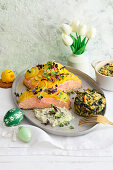Salmon fillet covered in scalloped potatoes with small spinach soufflés for Easter