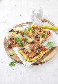 Polenta crust pizza with artichokes, mushrooms, and ham