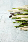 White, green, and purple asparagus spears