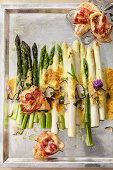 Colorful roasted asparagus with chicken wrapped in pancetta