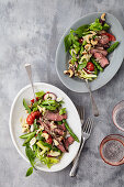 Lukewarm beef salad with green asparagus