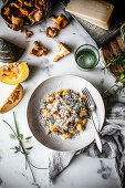 Squash gnocchi with chanterelles, olive oil and parmesan