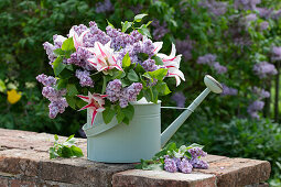 Bouquet of lilac and tulip 'Marilyn' in a watering can