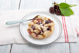 Donuts with vanilla pudding, cherries, and a crumble top