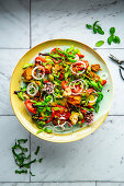 Vegan tomato bread salad with peppers and basil