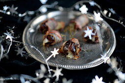 Bacon-wrapped dates with rosemary and French comte cheese