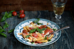 Pasta with tomatoes, burrata and basil