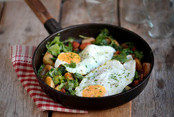 Kale and potato pan with chorizo and fried eggs