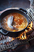 Bouillabaisse on an open fire