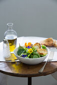 Wild herb salad with goat cheese au gratin