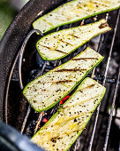 Courgette slices on a grill