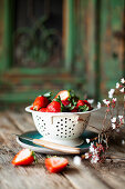 Fresh strawberries in vintage colander