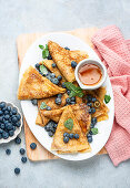 Crêpes with blueberries and honey