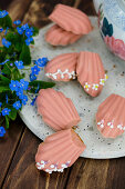 Pink madeleines with sugar decoration