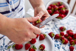 Cleaning fresh strawberries for jam