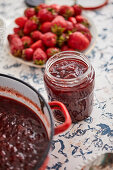 Freshly cooked strawberry jam in a jar