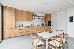 Living room with an oak kitchen and dining area